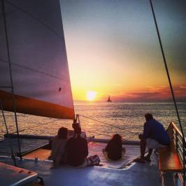 a group of people on a boat in the water
