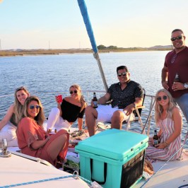 a group of people in a boat on a body of water
